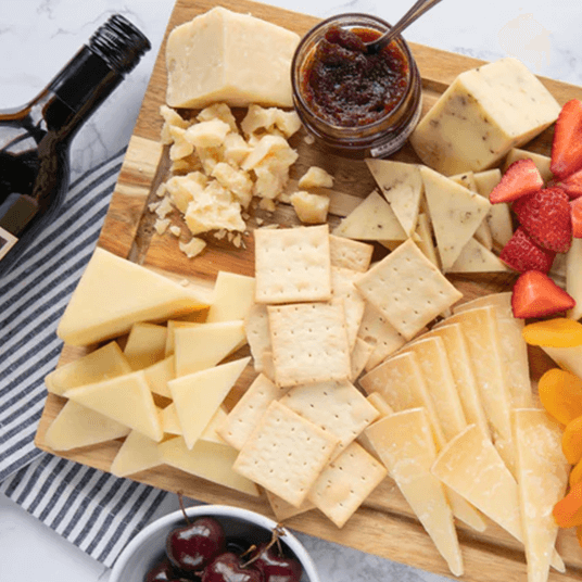 a plate filled with various cheeses