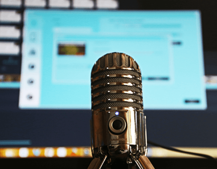an image of a microphone and laptop