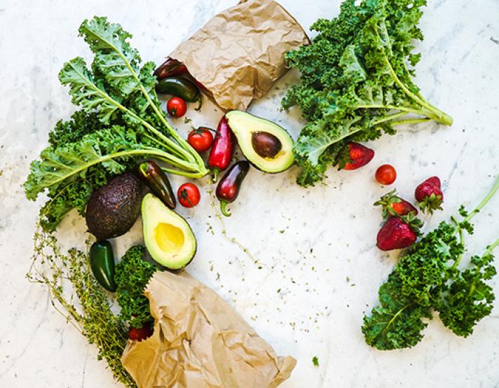 kale, avocado, and radishes on a countertop